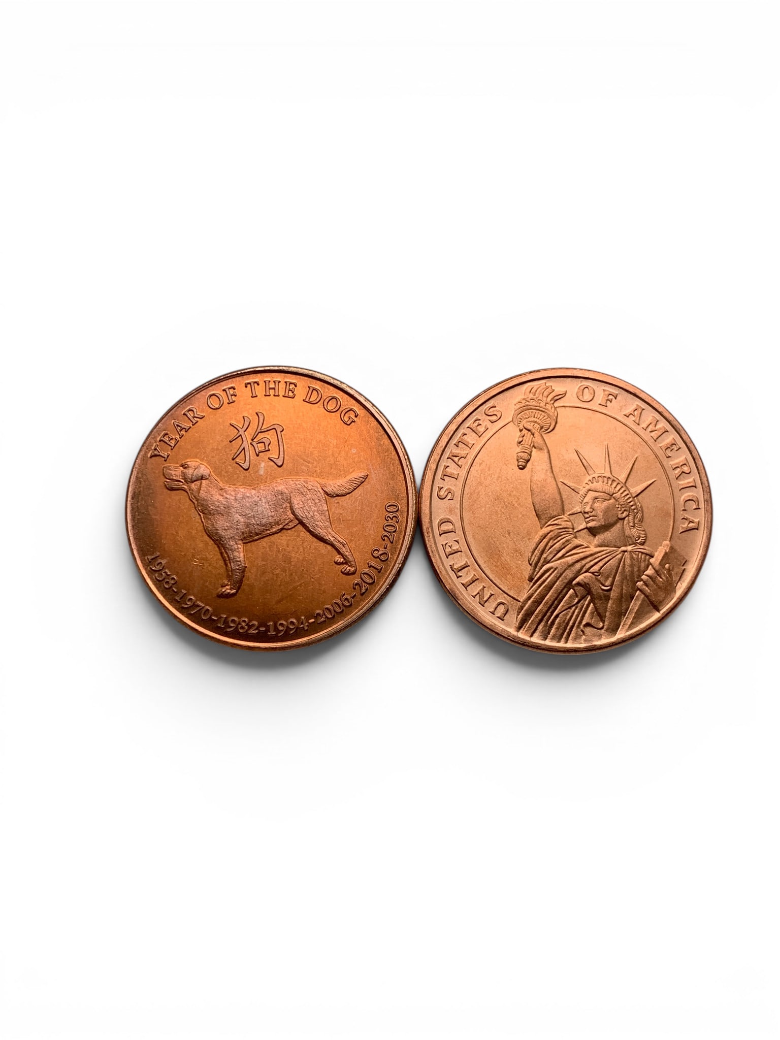 2 1-ounce Copper Rounds: 2 1-ounce Copper Rounds. 1 Round Depicting The Statue Of Liberty. 1 Round Depicting The Chinese New Year Of The Dog Marked: Copper .999 Fine Usa