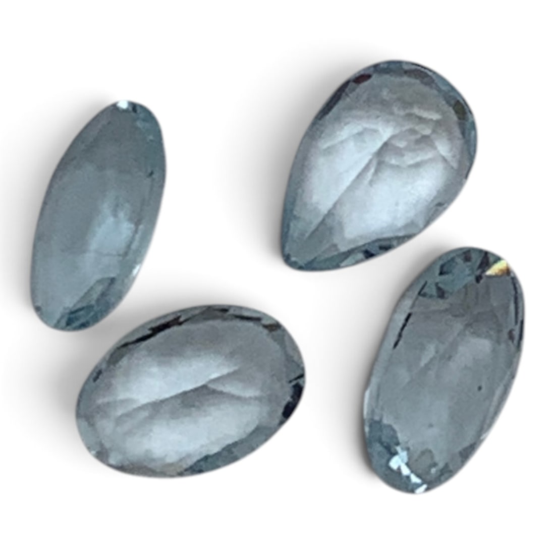 4 Faceted Clear Tourmaline Gemstones: 3 Oval Cut & 1 Teardrop Cut With Light Blue Tints1.420 Total Carat Weight Gemstones Tested With Presidium Gem Tester Il - Berners Does Not Guarantee Authenticity Of Gemstones