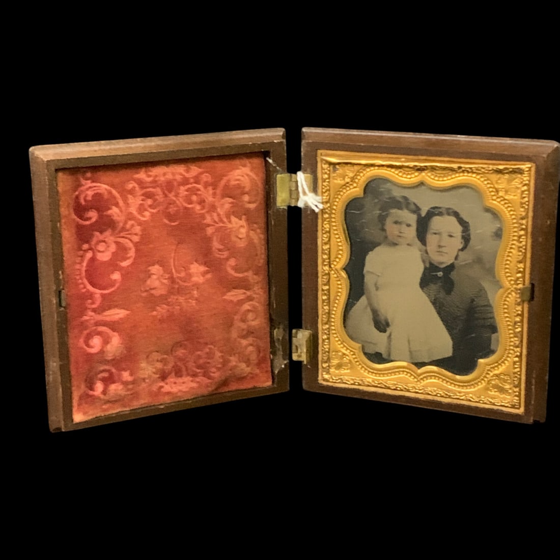 Antique 19th-century Cased Daguerreotype: Antique 19th-century Cased Daguerreotype Featuring A Portrait Of Two Individuals In A Hinged Case With An Ornate Brass Mat3 3/8" X 3 3/4"One Hinge Need Repaired