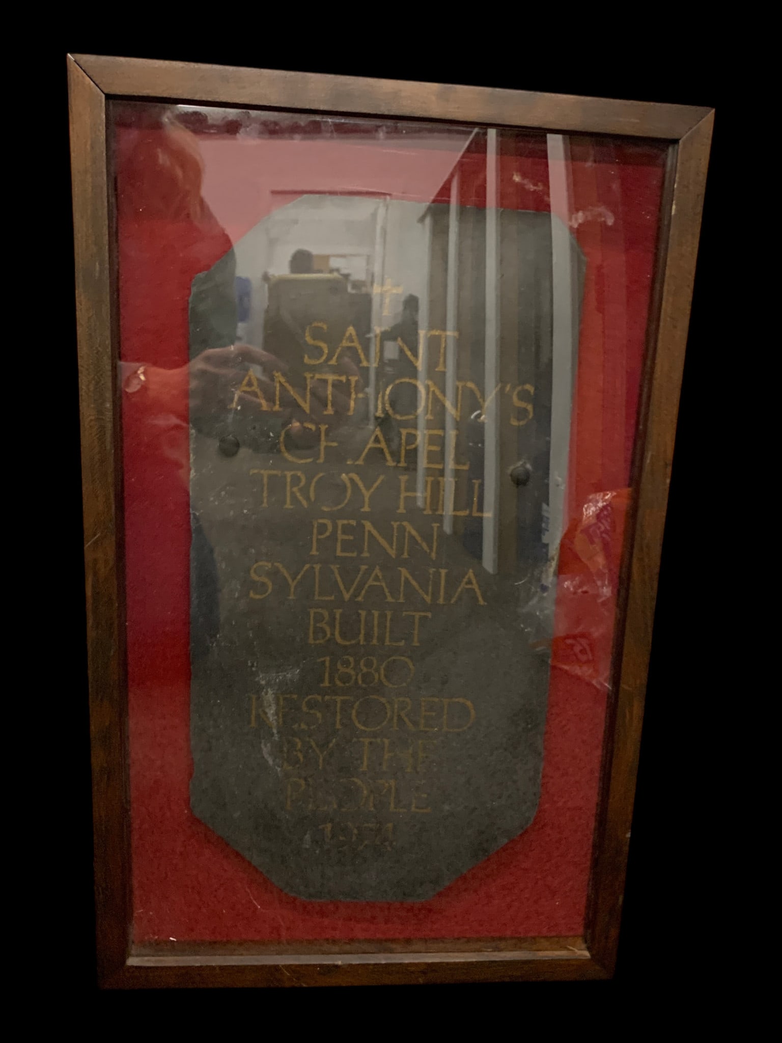 Dark Slate Commemorative Hanging Plaque: Dark Slate Commemorative Plaque Mounted On A Red Background Behind Glass Bearing Gold Lettering, Saint Anthony's Chapel, Troy Hill Pennsylvania, Built 1880, Restored By The People 197414" X 22"