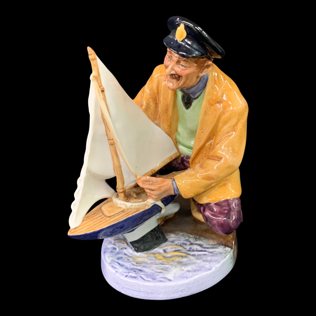 Royal Doulton Figurine, Sailor's Holiday: Royal Doulton Figurine Titled Sailor's Holiday Featuring A Man Holding A Toy ShipMarked On Bottom: Royal Doulton, Made In England, Sailor's Holiday, Hn 1971, Doulton & Co Limited6 3/8" Tall