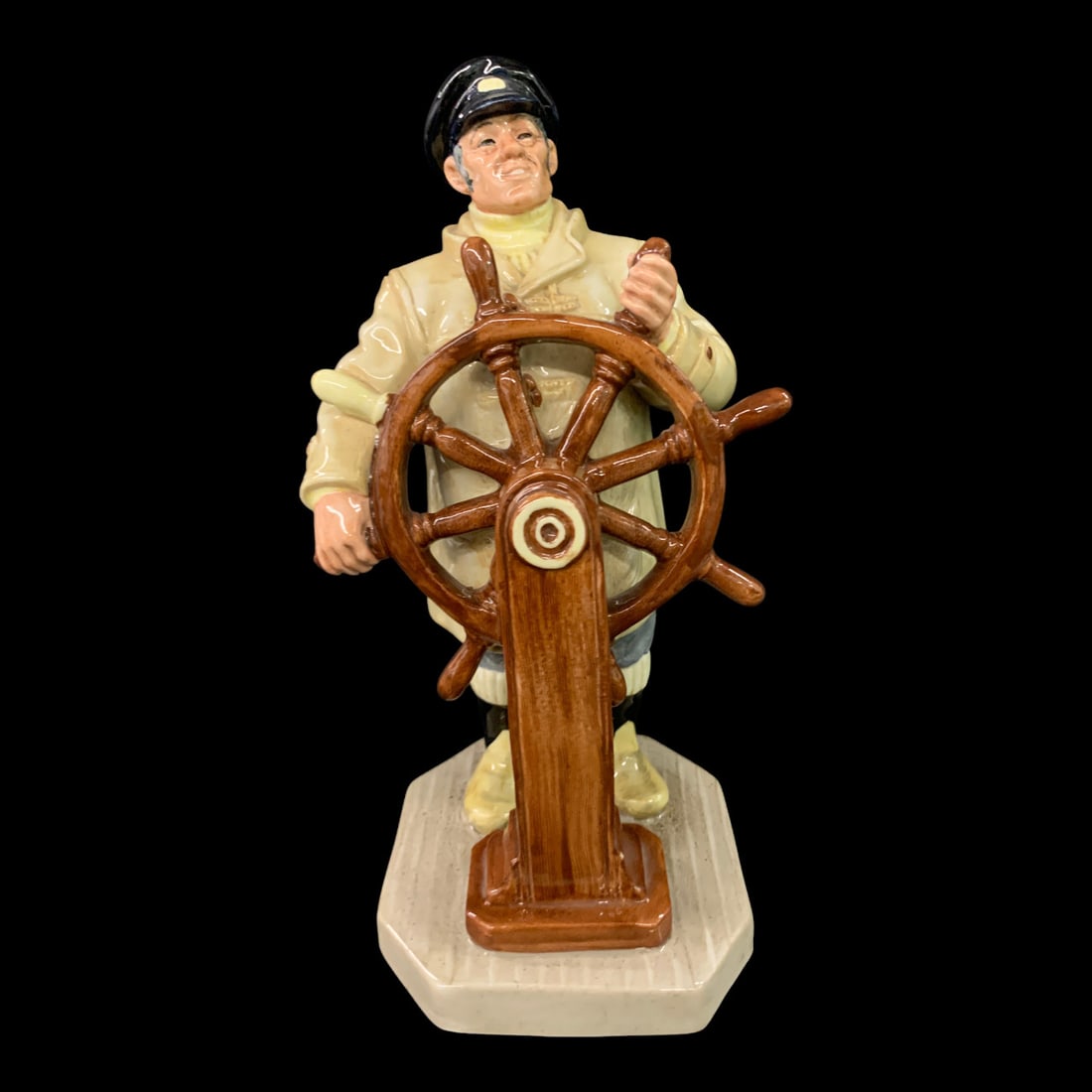 Royal Doulton Figurine, The Helmsman: Royal Doulton Figurine Titled The Helmsman Featuring A Man Standing At A Ships WheelMarked On Bottom: Royal Doulton, Made In England, The Helmsman, Hn 24999 3/8" Tall