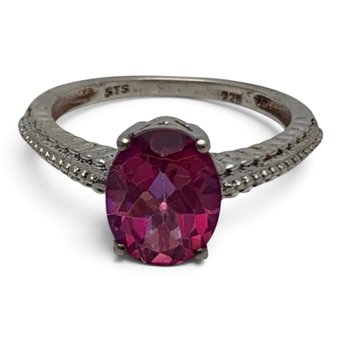 Sterling Silver Ring With Solitaire Pink Stone: Sterling Silver Ring With A Textured Band Design Featuring An Oval Cut Pink StoneMarked: 925 - Size 8 - 3.1 Grams