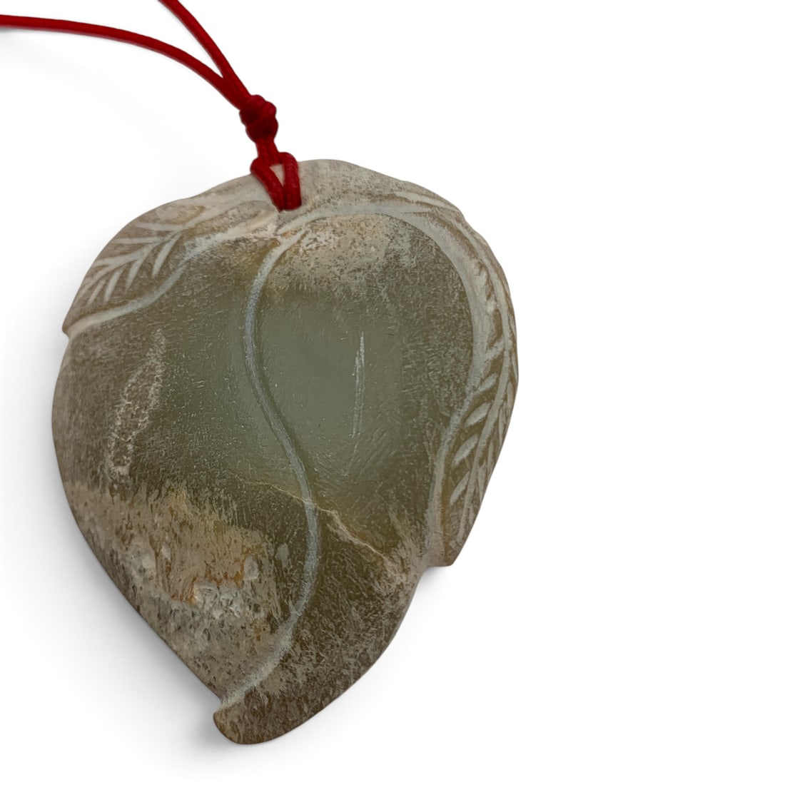 Light Colored Carved Hard Stone Pendant: Light Colored Carved Hard Stone Pendant On A Red Cord 1 7/8" Long Excluding The Cord