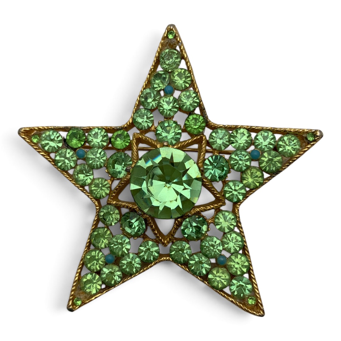 Vintage B S K Green Rhinestone Star Brooch: Vintage Gold Tone Designer Brooch Featuring Green Rhinestones Marked: B S K - 2 1/2" Long