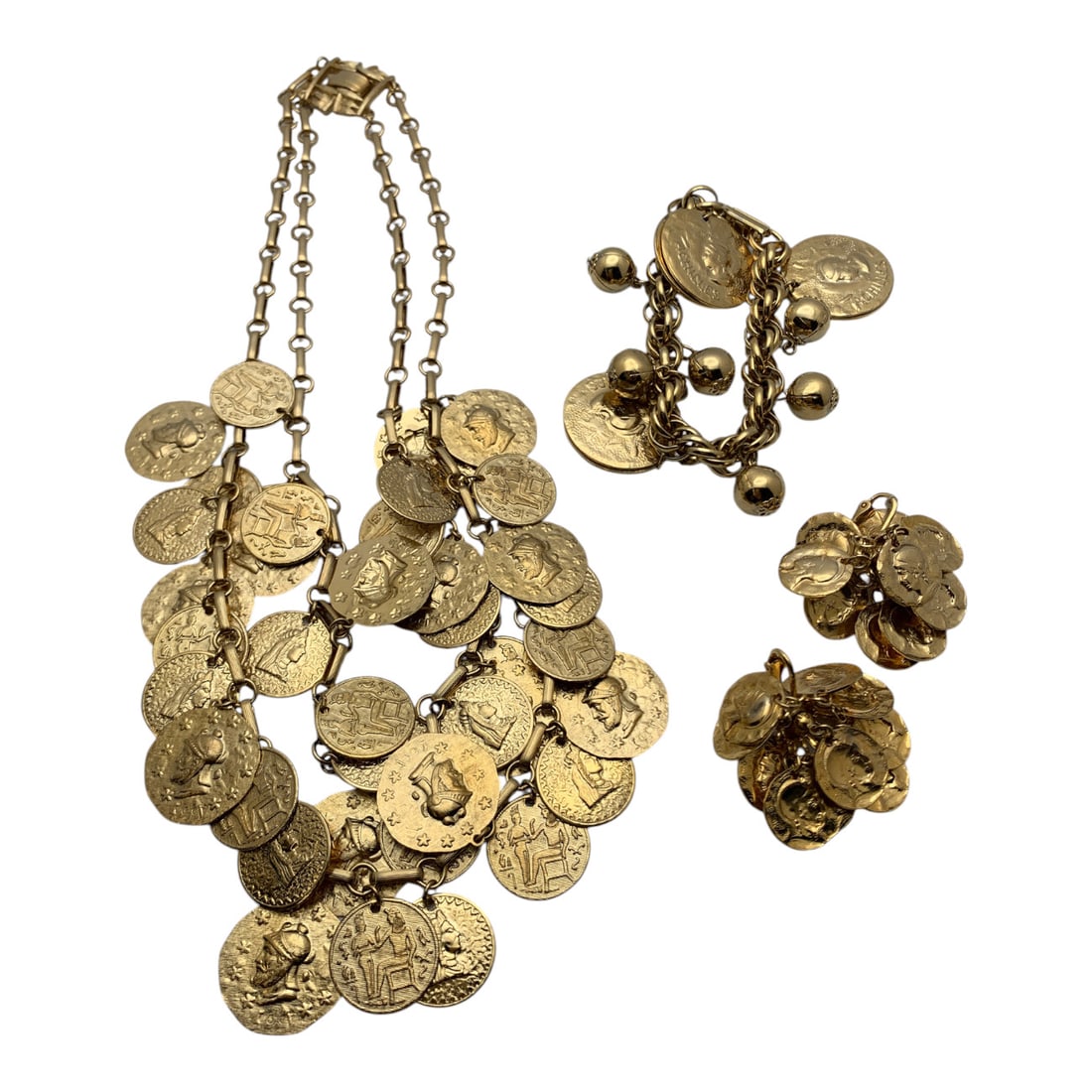 Vintage Set Of Gold Tone Fashion Jewelry: Vintage Set Of Gold Tone Fashion Jewelry Depicting Cameo Busts Including 1 Necklace, 1 Bracelet And 1 Pair Of Earrings Necklace Marked: CoroNecklace: 17 1/2" LongBracelet: 7 1/2" LongEarrings: 1 1/4"