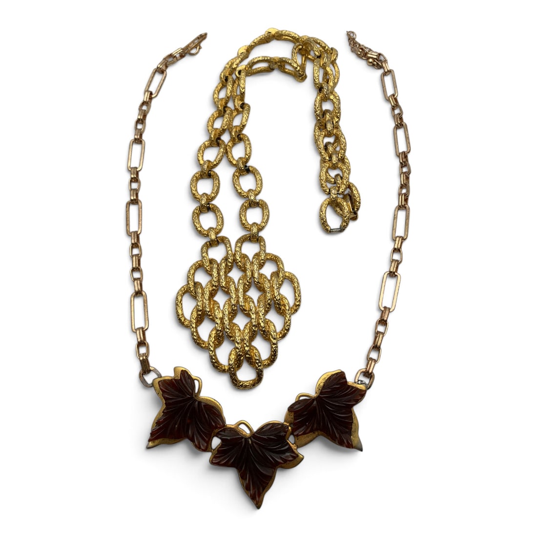 2 Vintage Fashion Necklaces: 2 Vintage Fashion Necklaces Including One Gold Tone Link Pendant Necklace And One Gold Tone Necklace Featuring A Carved Brown Stone Leaf Motif20 1/2" & 21 1/2" Long