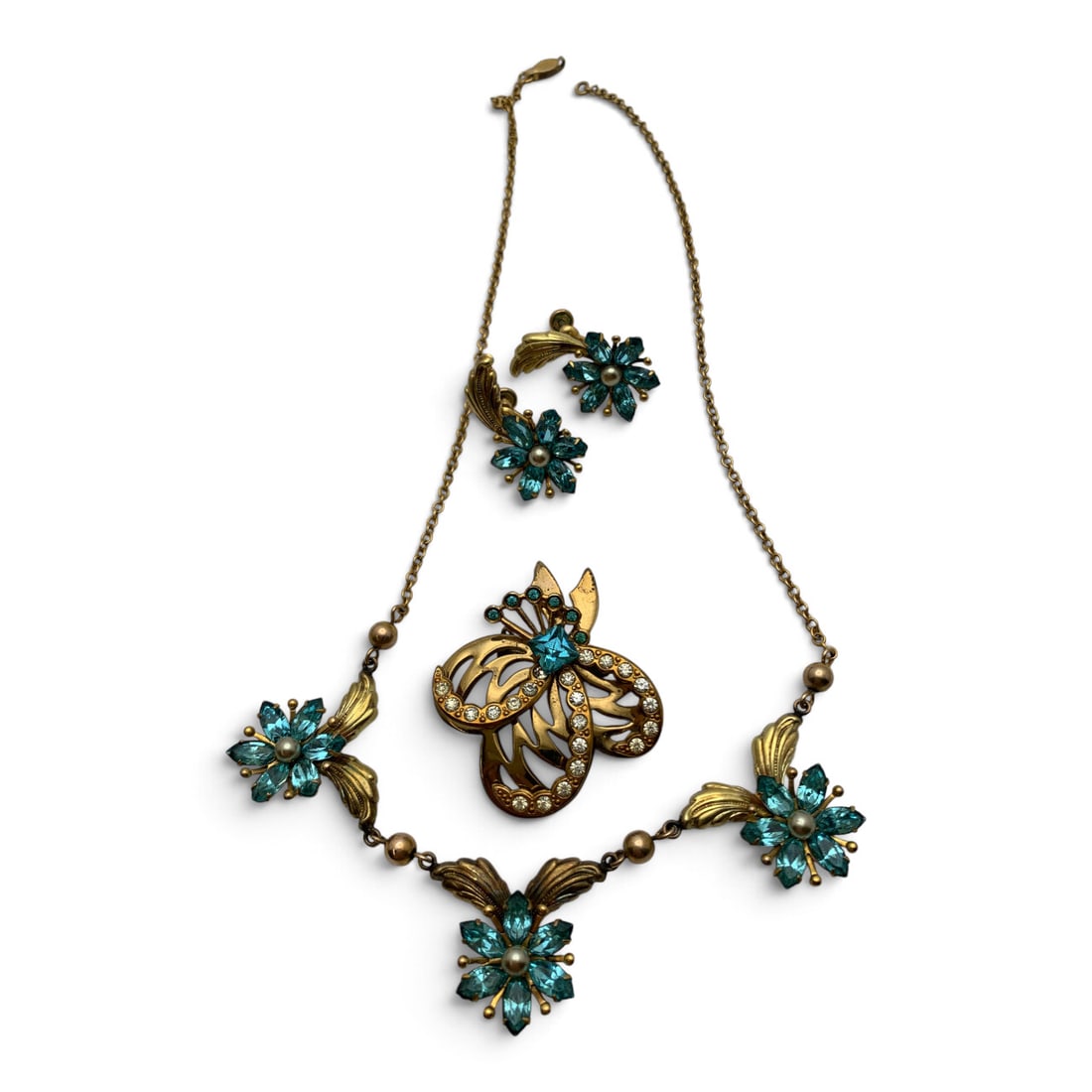 Vintage Gold Tone Fashion Jewelry Set: Vintage Gold Tone Fashion Jewelry Set Featuring Blue Rhinestones Including One 10k Gold Filled Necklace Signed Amco, One Brooch, And One Pair Of 10k Gold Filled Earrings Signed AmcoNecklace: Signed 10