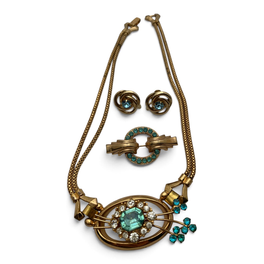 Vintage Gold Tone Fashion Jewelry Set: Vintage Gold Tone Fashion Jewelry Set Featuring Blue Rhinestones Including One Necklace Signed Coro, One Brooch, And One Pair Of Earrings Necklace Signed On Clasp: Coro - 15 3/4" Long Brooch: 1 3/4"