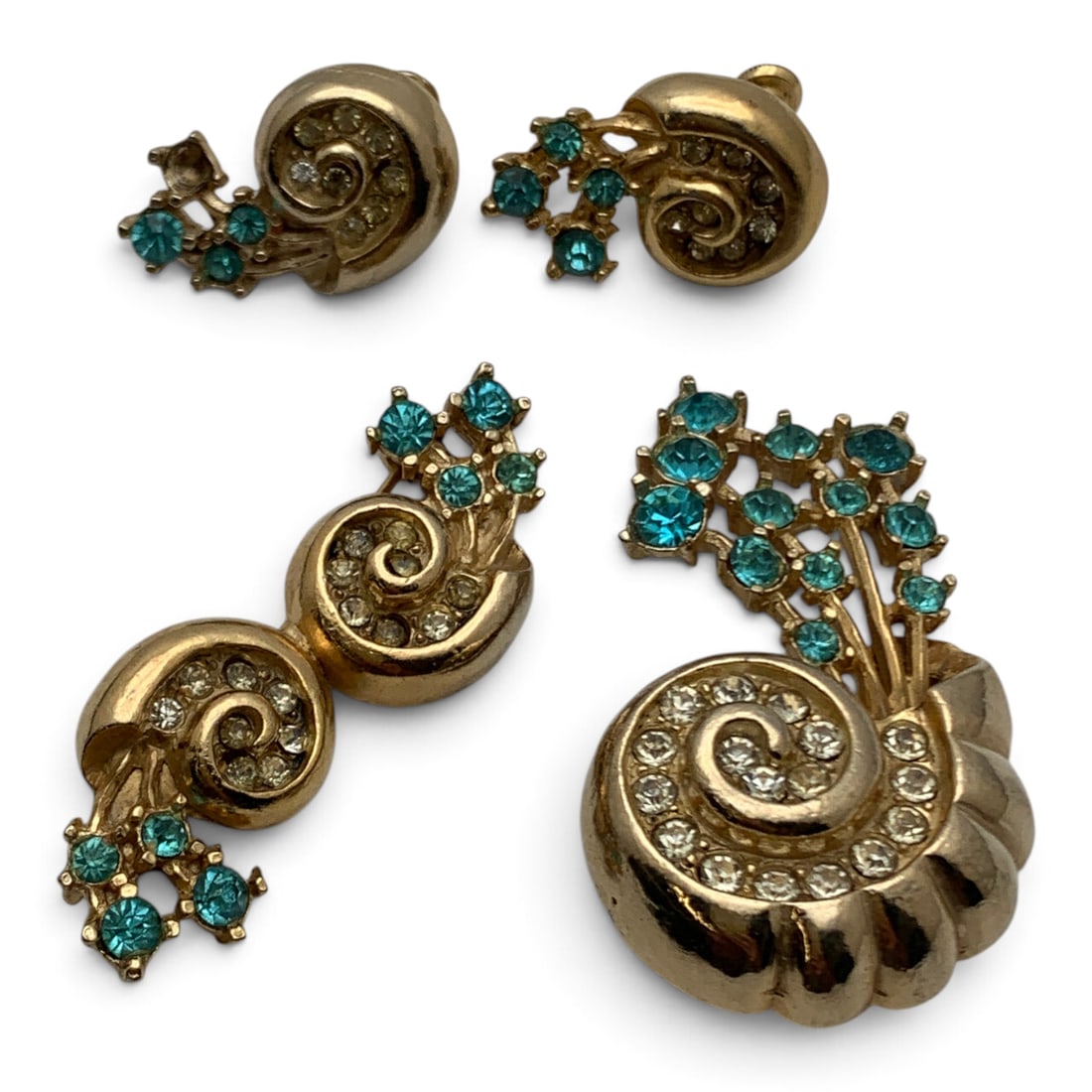 Vintage Gold Tone Fashion Jewelry Set: Vintage Gold Tone Fashion Jewelry Set Including One Pendant, One Brooch, And One Pair Of Earrings Featuring Clear & Blue Rhinestones Pendant: 2" LongBrooch: 2" Long1" Long