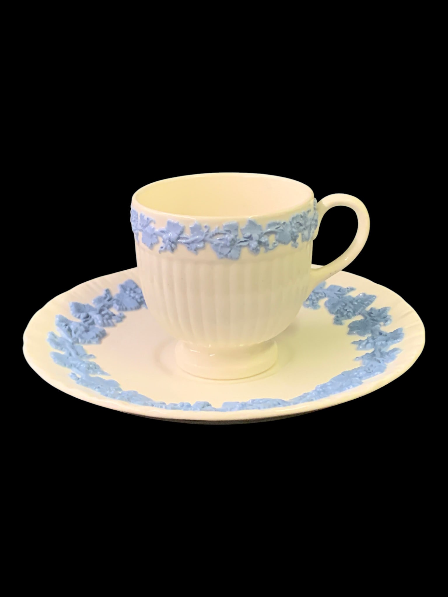 Vintage Wedgwood Queensware Teacup & Saucer: Vintage Wedgwood Queensware Teacup & Saucer Featuring An Embossed Blue Floral Pattern Marked On Bottom: Wedgwood Embossed Queenware, Made In EnglandCup: 2 3/8" TallSaucer: 5 3/4" Diameter