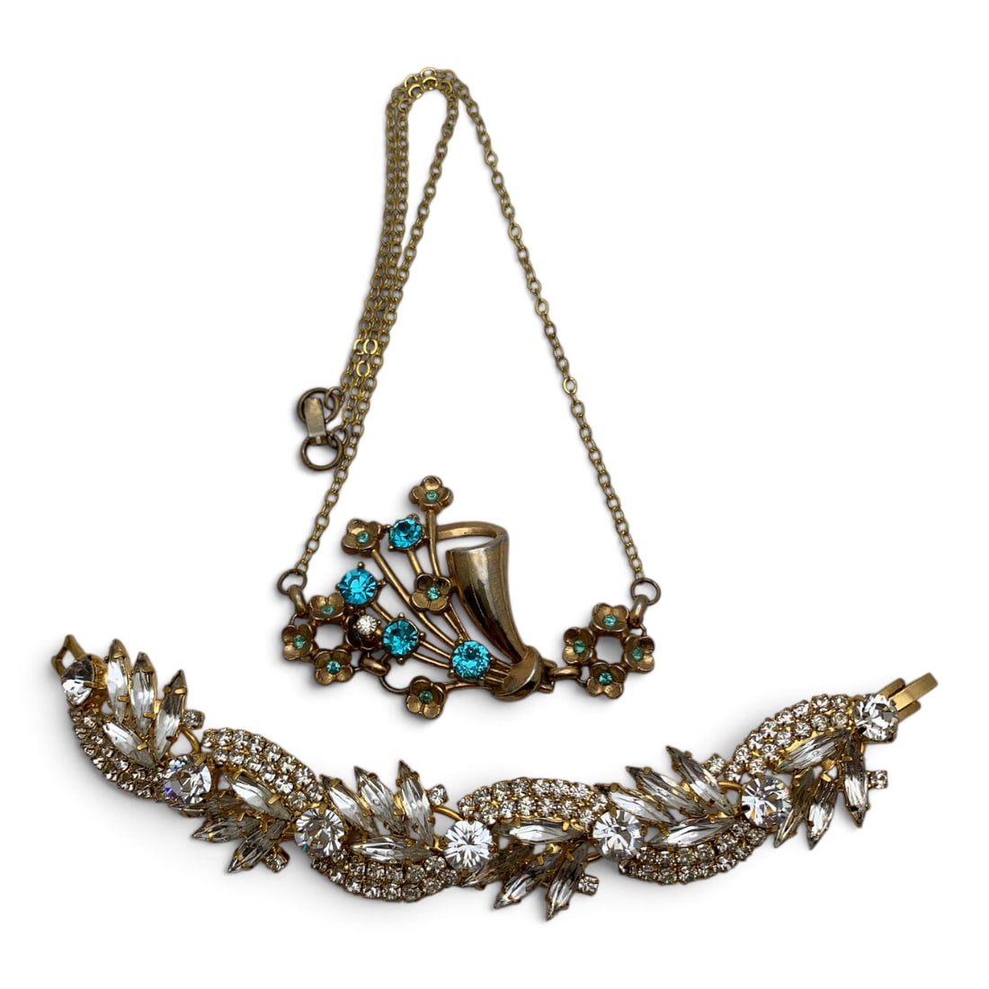 2 Vintage Gold Tone Fashion Jewelry Pieces: 2 Vintage Gold Tone Fashion Pieces Including One Necklace Featuring Blue Rhinestones And One Bracelet Featuring Clear Rhinestones 6 7/8" & 20" Long