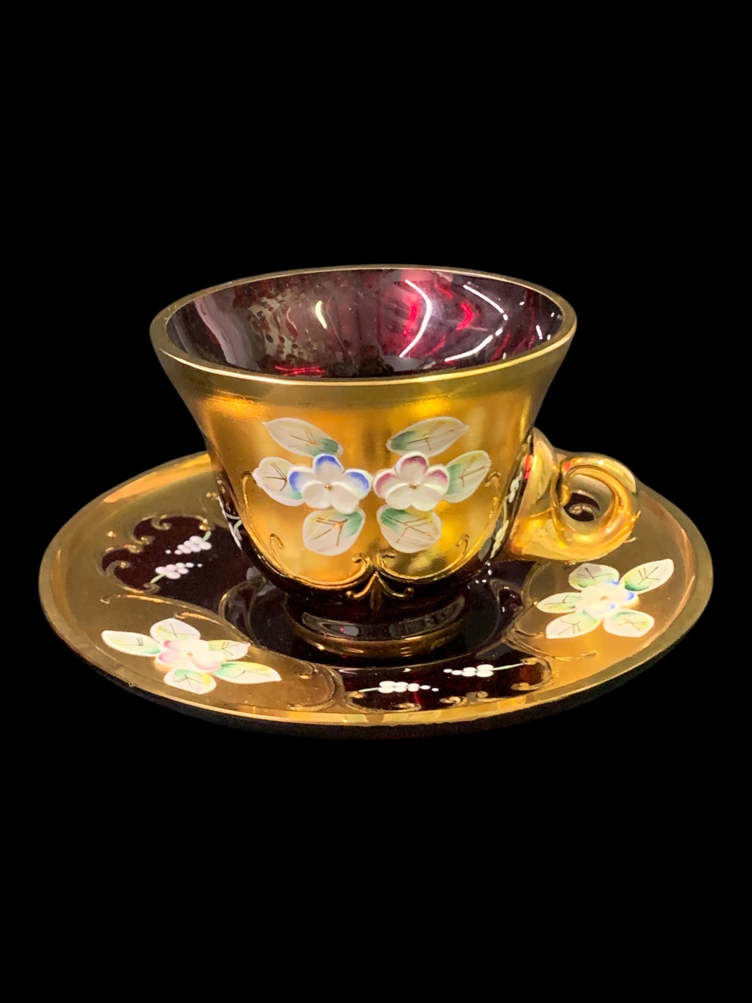Vintage Murano Ruby Red Glass Cup & Saucer: Vintage Murano Ruby Red Glass Cup & Saucer Set Featuring Heavy Gold Gilding And Hand Painted Floral Enamel Details In A Fitted Presentation Box Cup: 2 1/4" TallSaucer: 4 7/8" Diameter