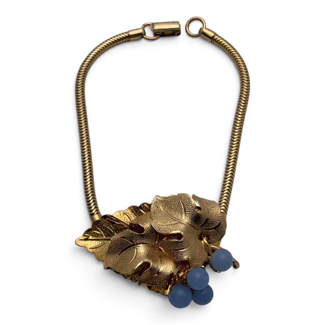 Signed Trifari Gold Tone Leaf Bracelet: Vintage Signed Trifari Gold Tone Bracelet With A Leaf Motif And Blue Stones Marked: Trifari - 8 3/8" Long