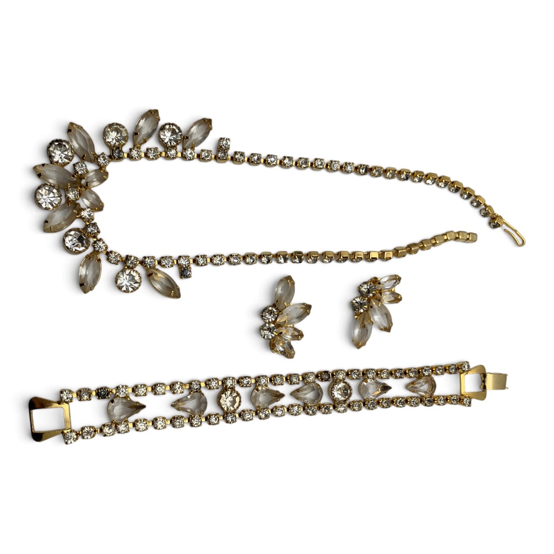 Vintage Gold Tone Rhinestone Fashion Jewelry Set: Vintage Gold Tone Fashion Jewelry Set Featuring Clear Rhinestones Including A Necklace, A Bracelet, And A Pair Of Clip Earrings Necklace: 14 7/8" Long Bracelet: 7 1/2" LongEarrings: 1 1/8" Long
