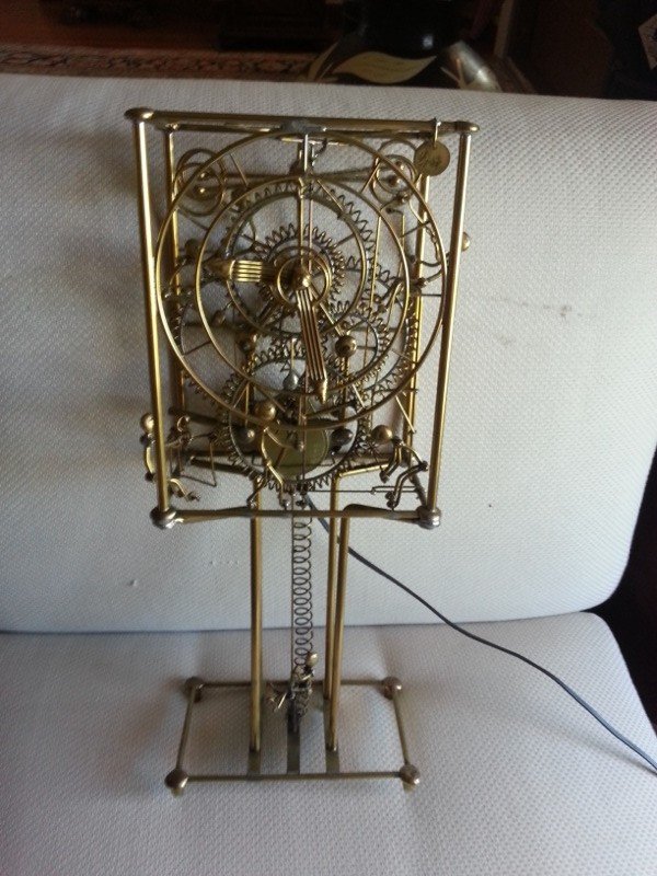 Gordon Bradt Kinetic 7 Man Clock: Modern Folk Art clock, 'Kinetic 7 Man Clock' by Gordon Bradt, Eureka Springs, Arkansas. Case: 17" sculptural case, signed 'Bradt' on a small round plaque at the upper right and made of solid brass wit