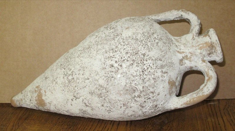 Ancient Amphora Excavated in Malta: Ancient amphora excavated in Malta. c. 3rd-1st Century BC. Greco-Roman, wine or oil storage amphora, with a creme slip, intact with marine deposits and encrustation. This lot is as described or your m