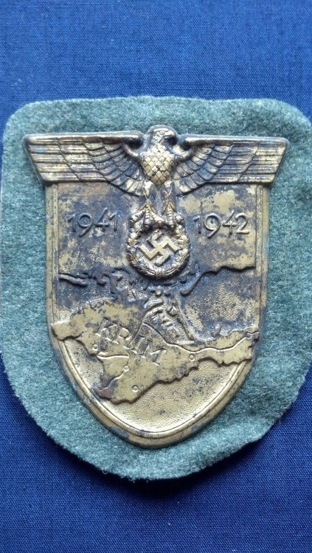 Nazi Krim Shield WW2 German Uniform Insignia: Nazi Krim Shield appears to have been worn in combat. Attached to Heer color wool.