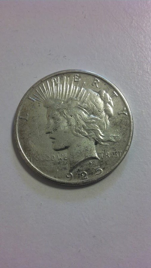 Beautiful U.S. Peace Dollar 90% Silver 1925: Very Good near Uncirculated Condition U.S. 90% Silver Peace Dollar. From beautiful New England Estate Collection. Tangible Silver, a one of a kind investment!