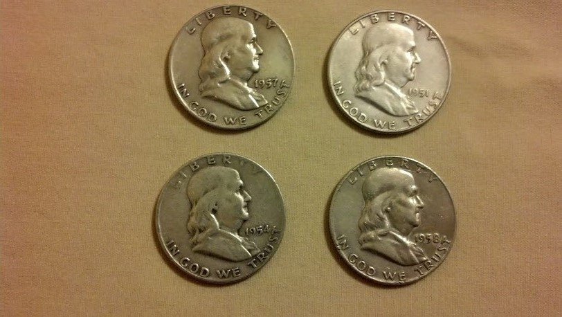 Estate Lot 4 Franklin 90% Silver Half Dollars U.S.: Four slightly circulated Franklin 90% Silver Half Dollars from a beautiful New England Estate. Tangible Silver great for investing! Bidding starts at just under melt, remember we have 0% Buyers Premiu