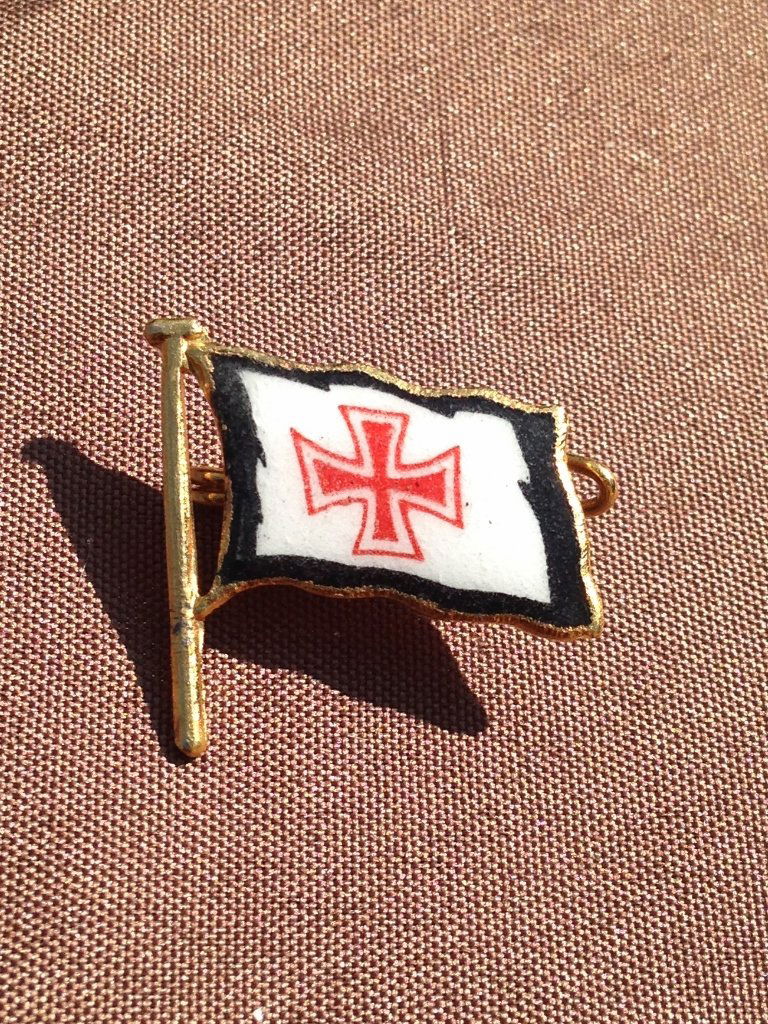 German WW2 era Flag insignia Kriegsmarine Enamel Pin: Enamel on brass German pin with Red Iron Cross on a White with Black Trim German Flag. Rare pin in Excellent Condition!