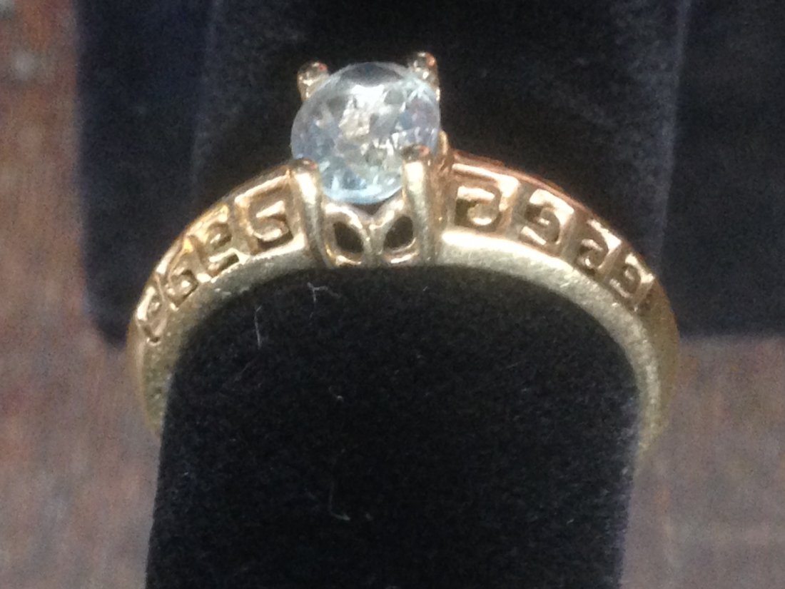 14K Womens Solitare Ring Gold with White Aquamarine: Beautiful Womens Ring Size 6 made of Solid 14K Gold with a very light blue to white aquamarine set in Solitaire setting. Gold has designs that make the stone look excellent as well as eye catching.