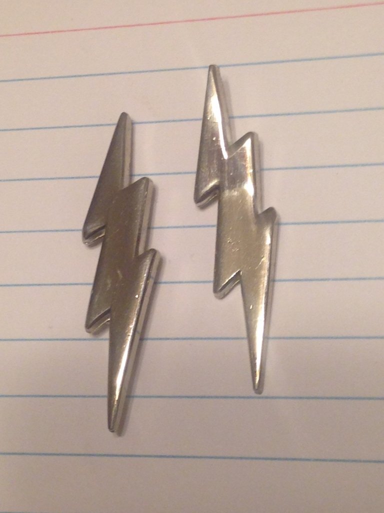 Veteran's Estate Lightning Bolt Pins Post WW2 U.S.: Lightning Bolt pins matching clutch back design, different from German SS Bolts this appears to be an American Design. From Veteran's Estate Collection. Reverse has 2 clutch pin posts and brass clutch