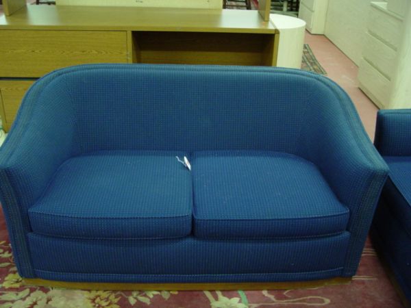 A Pair of Love Seats: A Pair of Love Seats, upholstered in blue fabric, Jack Cartwright identifacation tags under the cushions, (H: 28", L: 56").