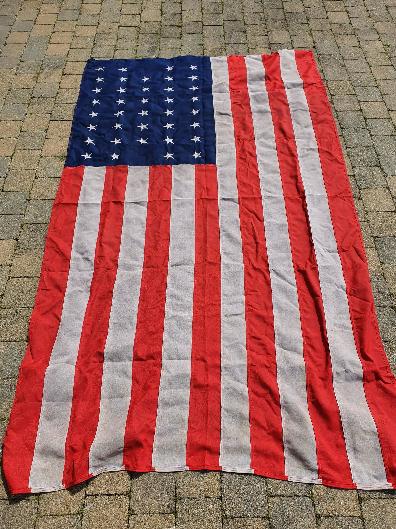 A large American Flag. (1) (19 Podium).: A large American Flag. (1) (19 Podium).
