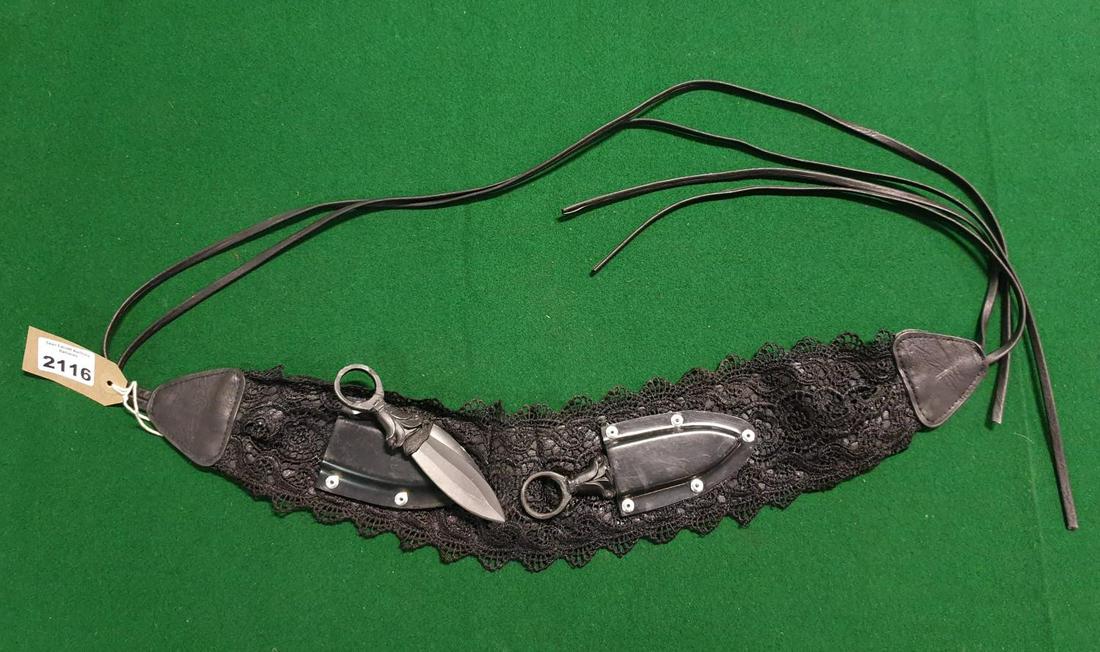 THE WIDOW IS PLAYED BY EMILY BEECHAM. THE WIDOW: A: THE WIDOW IS PLAYED BY EMILY BEECHAM. THE WIDOW: A Chest Scabbard belt with Knives(prop). (AP63)
