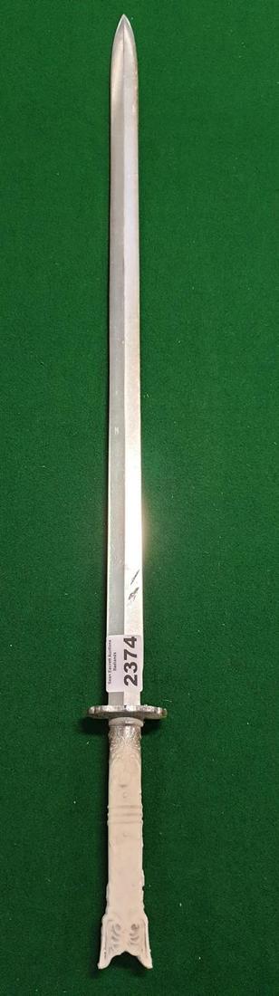 THE WIDOW IS PLAYED BY EMILY BEECHAM. THE WIDOW: THE WIDOW IS PLAYED BY EMILY BEECHAM. THE WIDOW BADLANDS SERIES 2: The Widow's Sword. White handle. (Prop). (1) (24) AP 216.