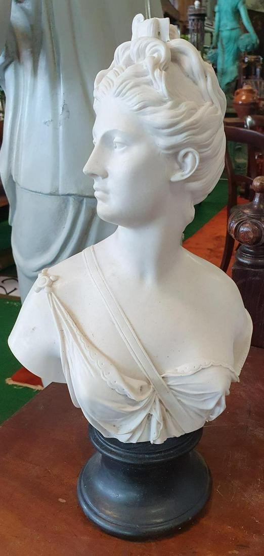 A Parian Figure of a woman's head.(1)(14/22): A Parian Figure of a woman's head on base. H 34cm approx. (1)(14/22)