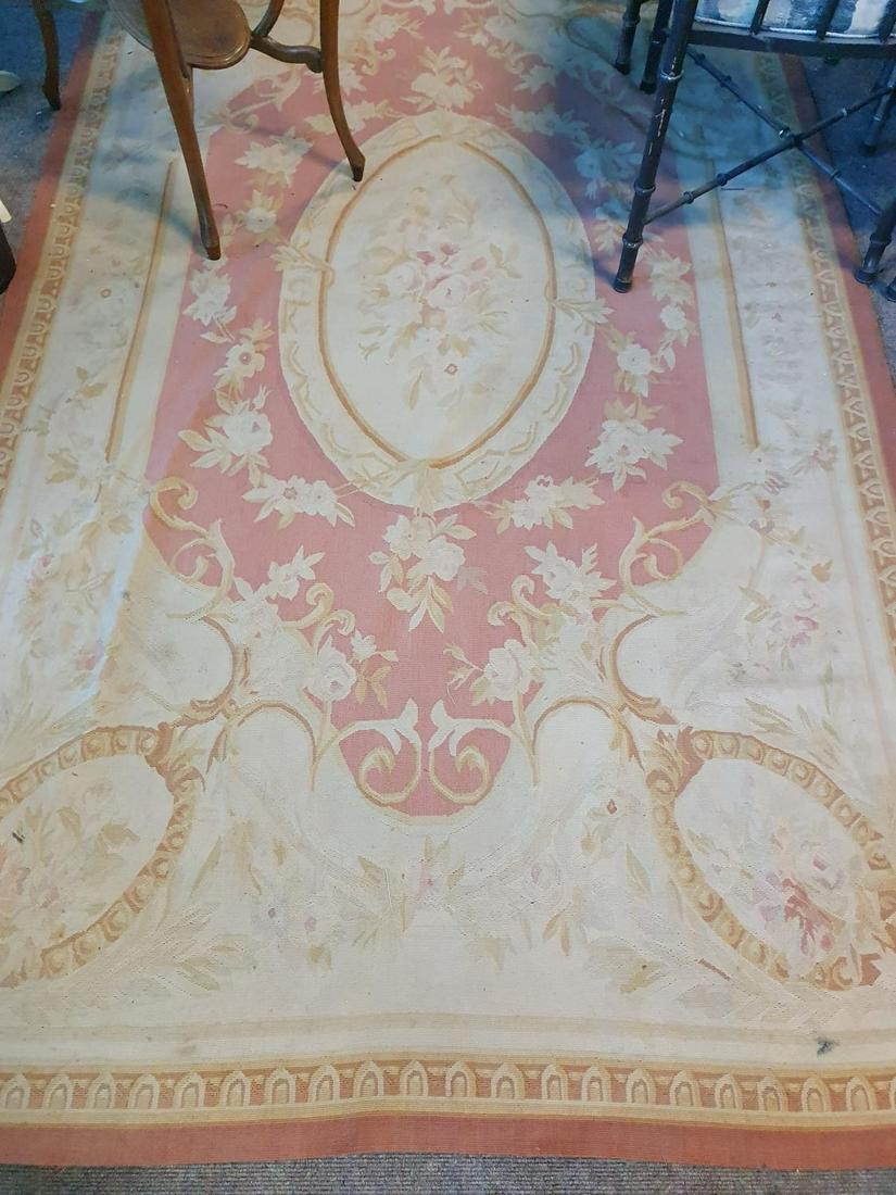 An Aubusson design Rug with cream/pink ground. W 144 x: An Aubusson design Rug with cream/pink ground. W 144 x L 253cm. approx.(1)(16/17)