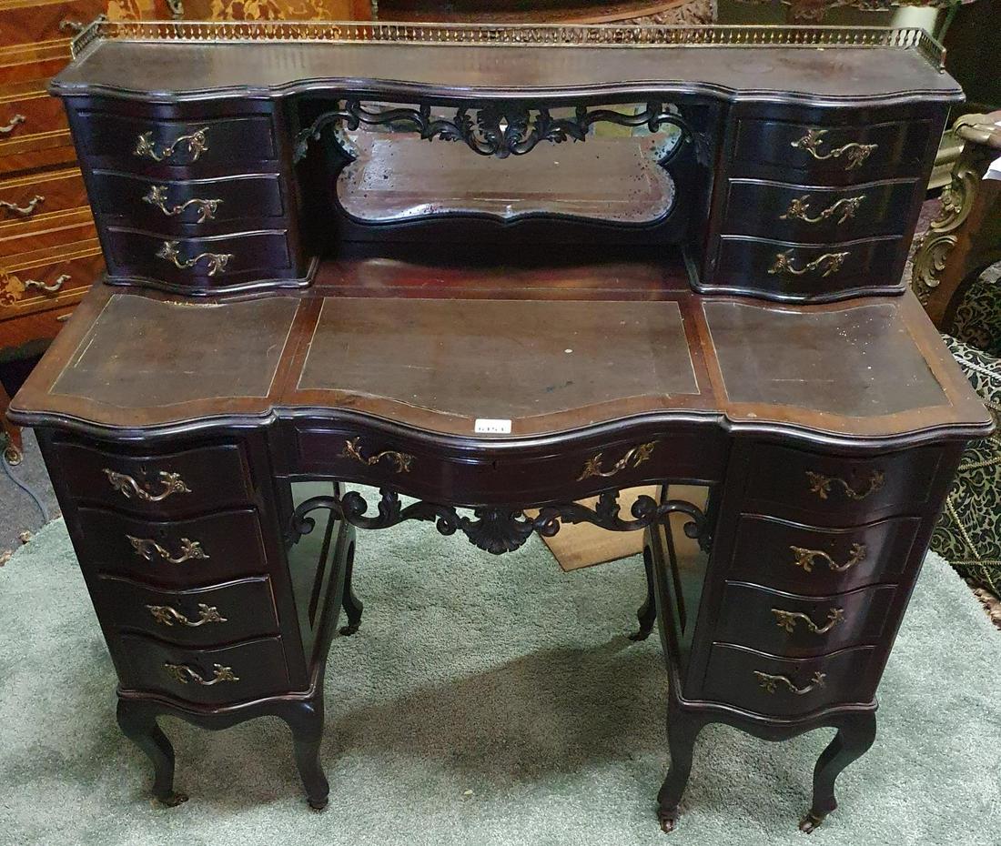 An Edwardian Serpentine fronted Desk with leather top: An Edwardian Serpentine fronted Desk with leather top and gallery back. W 108 x H 72 desk x D 52 cm approx. (1) (19).