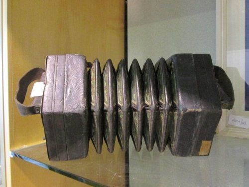 A C. Jeffries Concertina with thirty-two bone buttons : A C. Jeffries Concertina with thirty-two bone buttons on pierced foliate brass ends, six-fold bellows.
