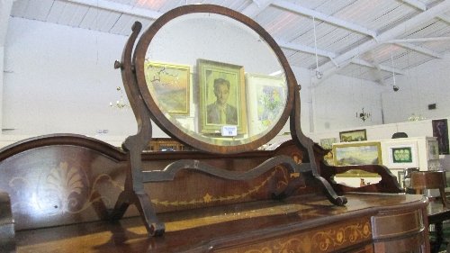 An Edwardian Mahogany Oval Crutch Mirror. : An Edwardian Mahogany Oval Crutch Mirror.