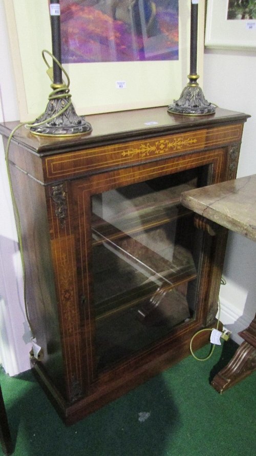 A Mid 19th Century Walnut and Inlaid Pier Cabinet with : A Mid 19th Century Walnut and Inlaid Pier Cabinet with ormolu mounts, fitted three shelves enclosed by a glass door.