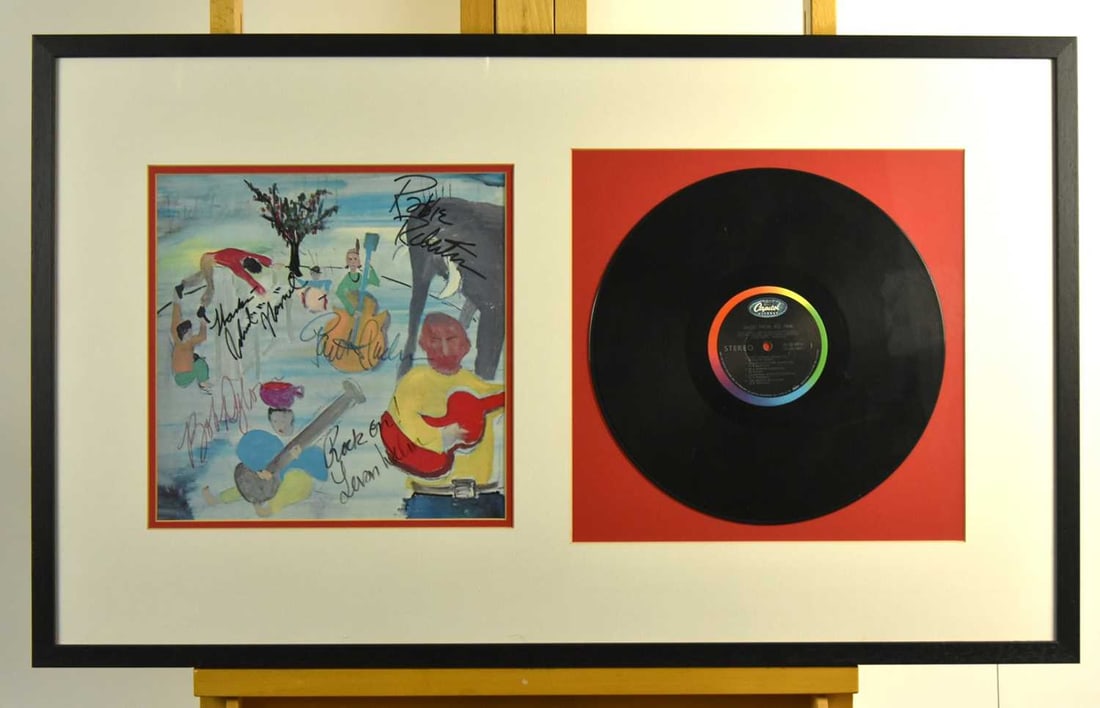 A collection of five signed framed vinyl's bearing ink signatures: A Simon and Garfunkel 'Bridge Over Troubled Water' vinyl LP, bearing ink signatures, within frame, 69.5 x 48.5cm, with accompanying 'The Autograph Collection certificate', together with a Bob Dylan 'A