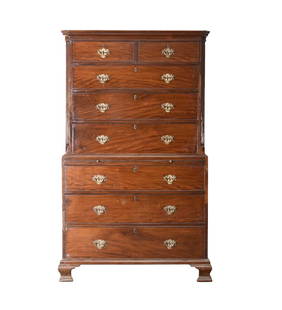 A George III mahogany chest on chest: A George III mahogany chest on chestThe upper section with cavetto cornice above two short and three long graduated and cock-beaded drawers, the lower section with brushing slide above three long grad