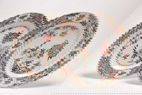 A pair of large Chinese famille rose dishes, late 18th century: A pair of large Chinese famille rose dishes, late 18th centuryOf plain round form, decorated in colours with chrysanthemum flowers and leafy bamboo, the rims with complex flower panel borders.39.5cm d