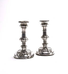 A pair of George III silver mounted candlesticks: A pair of George III silver mounted candlesticks, Robert Gainsford, Sheffield 1814, each with knopped stem and raised on shaped circular base, 18.5cm high (loaded) (2)