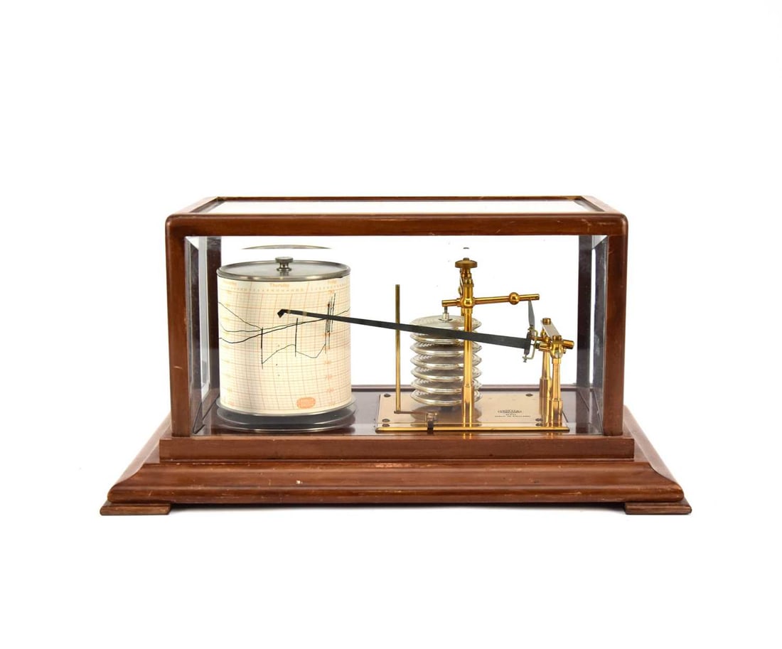 A 20th century mahogany cased barograph: A 20th century mahogany cased barographCasella, LondonWith seven-tier bellows, lacquered brass, contained within a five-glass case, raised on an ogee plinth.37.5cm wide x 23.5cm deep x 19cm high Condi
