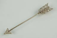 An early 20th century diamond set arrow pin, the arrow