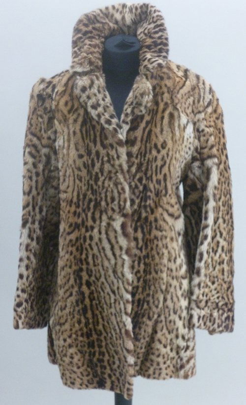 A Ladies Ocelot Jacket, pre 1947, labelled James Smith: A Ladies Ocelot Jacket, pre 1947, labelled James Smith Furriers, Staffs, lined in silk sateen patterned fabric, hook and loop fastenings, 87cm long , chest 84cm