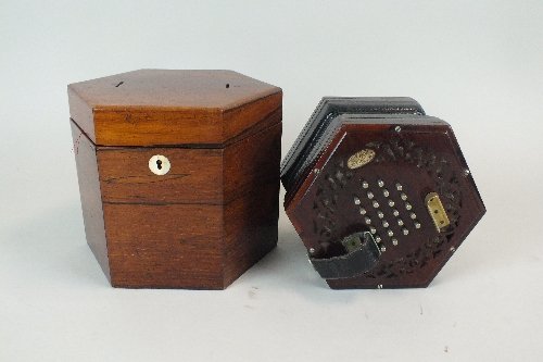 A 19th century Lachenal & Co rosewood concertina, with: A 19th century Lachenal & Co rosewood concertina, with 24 nickel keys and patterned green leather bellows in original rosewood case, 16cm across (2)