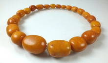 A graduated amber bead necklace, comprising