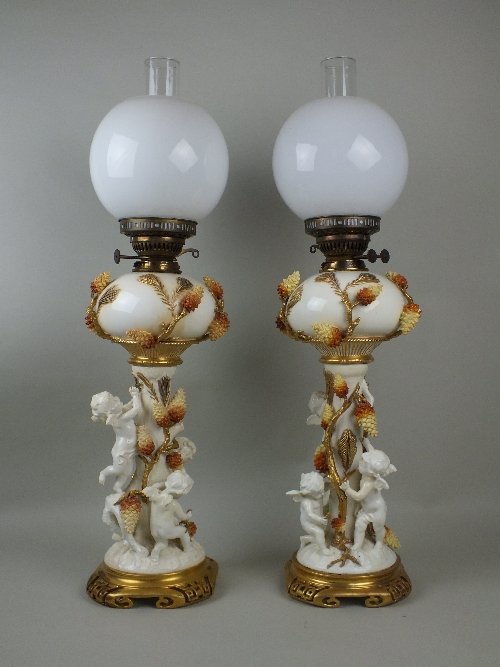 A near pair of Moore Bros. porcelain oil lamp bases,