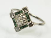 An Art Deco diamond and emerald cluster ring, designed