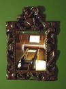 An 18th century style walnut carved and pierced frame