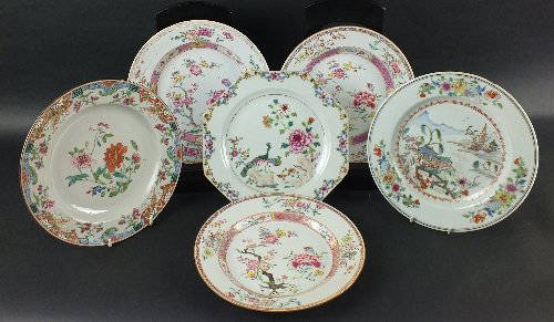 A group of six Chinese porcelain plates, Qianlong: A group of six Chinese porcelain plates, Qianlong period, each decorated in the famille rose palette, three examples with a blossoming peony next to a flowering tree within floral borders, the